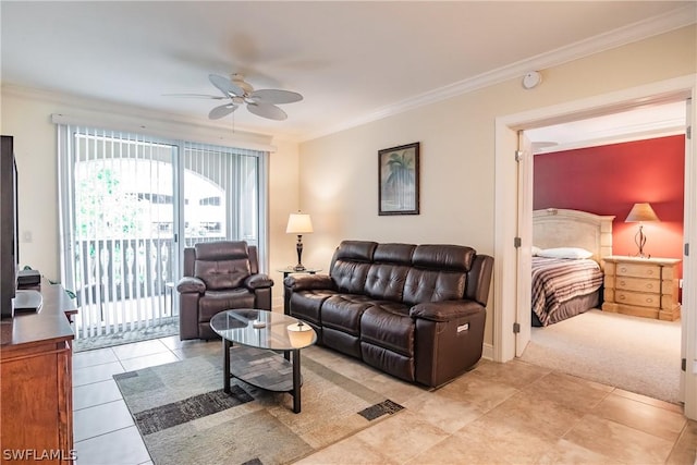 carpeted living room with ceiling fan and ornamental molding