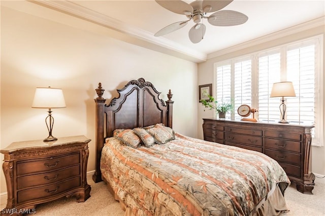 bedroom featuring ceiling fan, ornamental molding, and light carpet