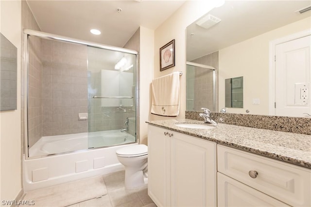 full bathroom with enclosed tub / shower combo, vanity, toilet, and tile patterned flooring