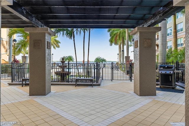 view of patio featuring area for grilling and a pergola