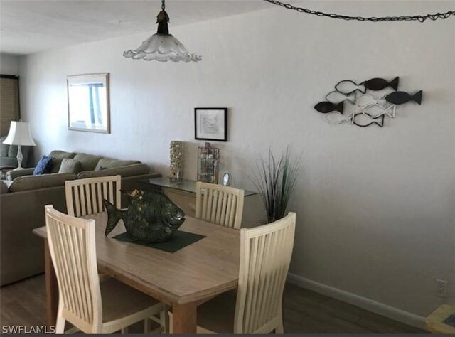 dining area with wood-type flooring