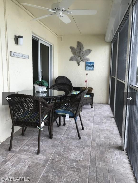 sunroom / solarium with ceiling fan