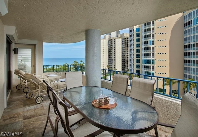 balcony featuring a water view