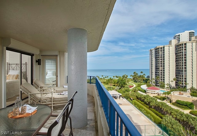 balcony featuring a water view