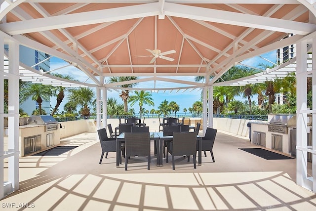 view of patio featuring a gazebo, an outdoor kitchen, a grill, and ceiling fan