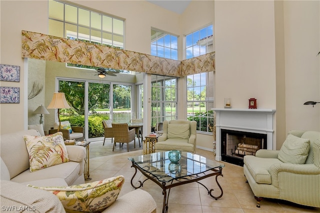 sunroom / solarium featuring ceiling fan