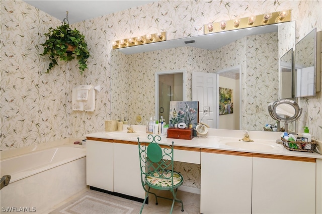 bathroom with vanity, tile patterned floors, and a bathing tub