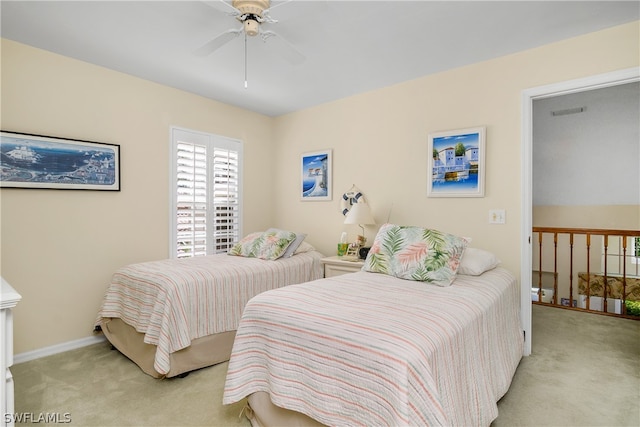 bedroom featuring light carpet and ceiling fan