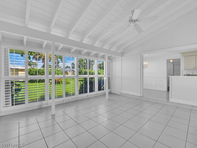 unfurnished living room with light tile patterned flooring, lofted ceiling with beams, and ceiling fan