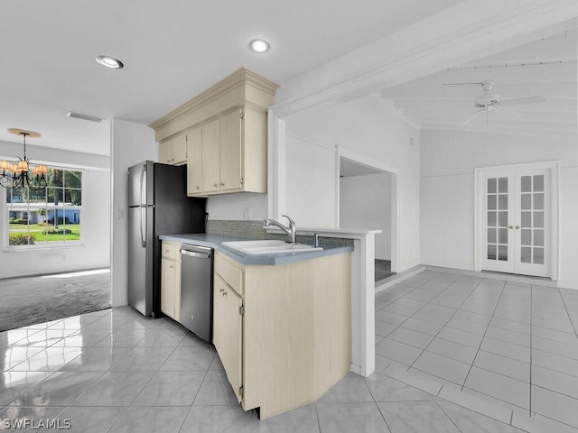 kitchen with ceiling fan with notable chandelier, lofted ceiling with beams, stainless steel dishwasher, light tile patterned floors, and sink