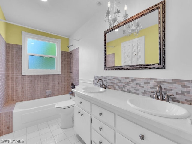 full bathroom featuring a sink, toilet, bathing tub / shower combination, and tile patterned floors