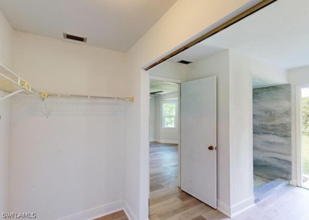 walk in closet featuring light wood-type flooring