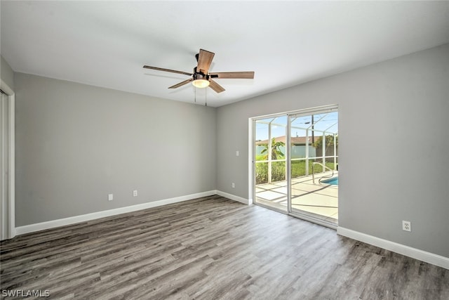 unfurnished room featuring hardwood / wood-style floors and ceiling fan