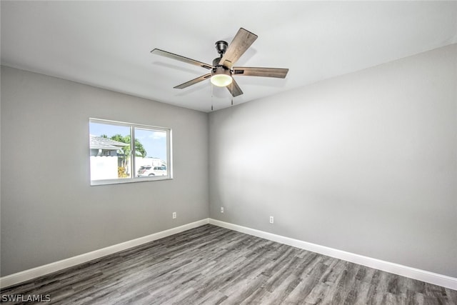 spare room featuring hardwood / wood-style floors and ceiling fan