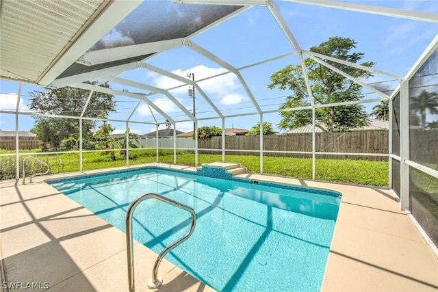 view of pool with a lanai, a yard, and a patio