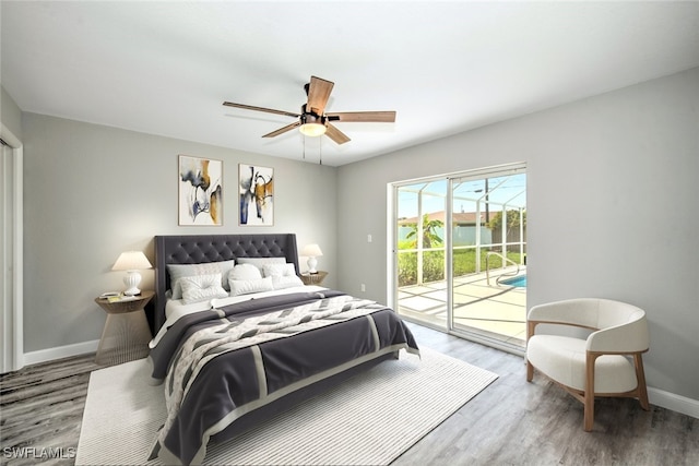 bedroom with hardwood / wood-style floors, ceiling fan, and access to outside