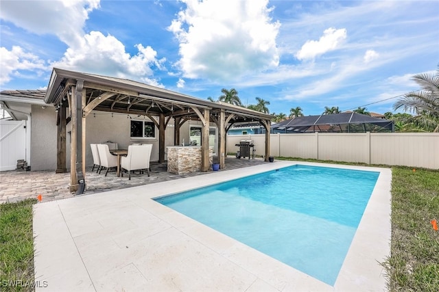 view of swimming pool with a patio, area for grilling, and a gazebo