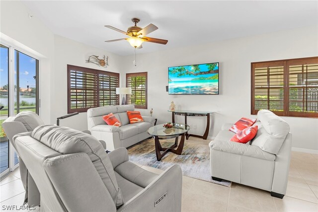 living room featuring light tile patterned flooring and ceiling fan