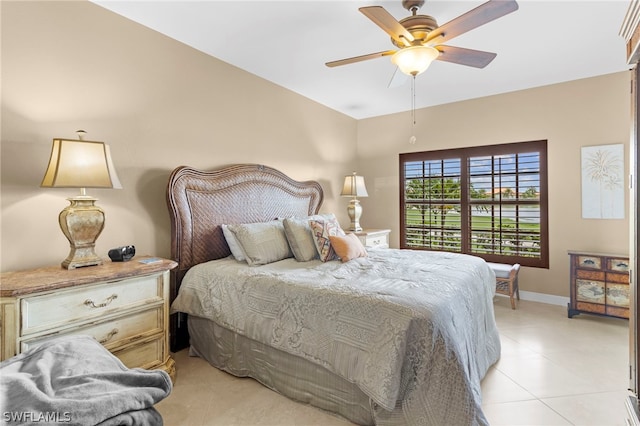 tiled bedroom with ceiling fan