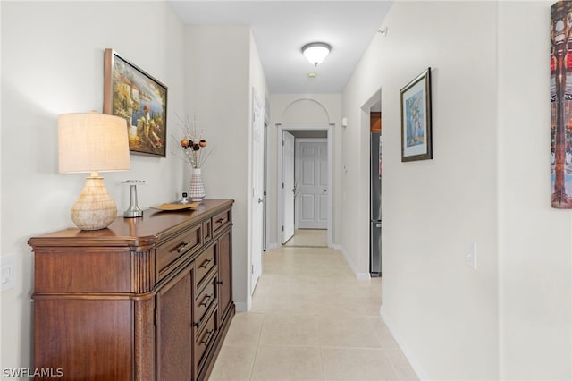 hallway featuring light tile patterned flooring