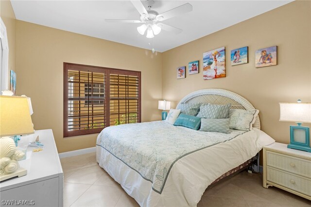 bedroom featuring ceiling fan and light tile patterned floors