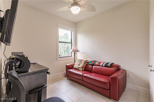 living room with ceiling fan and light tile patterned flooring