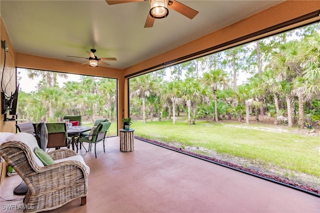 sunroom / solarium with ceiling fan