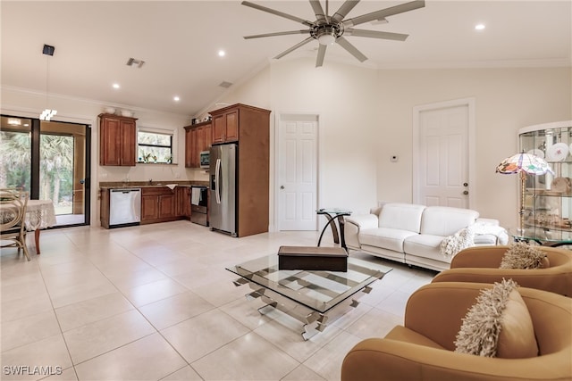 living room featuring ceiling fan, ornamental molding, vaulted ceiling, and light tile patterned floors