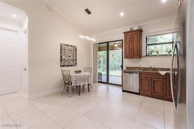 kitchen with appliances with stainless steel finishes, light stone countertops, light tile patterned floors, vaulted ceiling, and hanging light fixtures