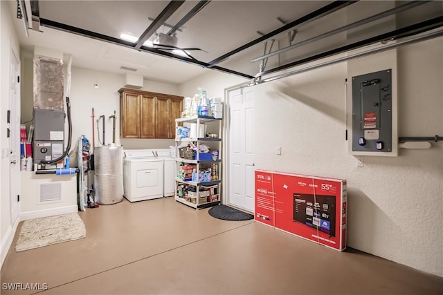 garage featuring independent washer and dryer and electric panel