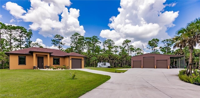 view of front of property with a carport, a garage, and a front yard