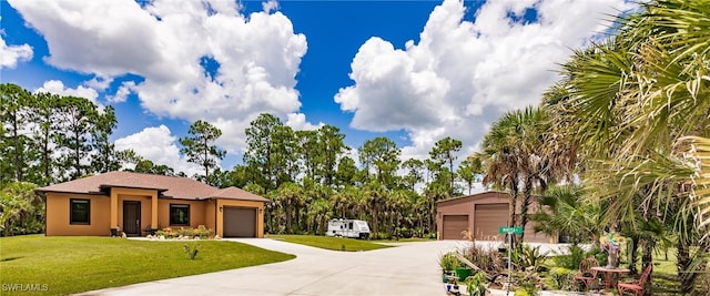 view of front facade with a garage and a front lawn