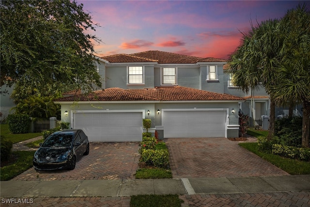 mediterranean / spanish-style home featuring a garage