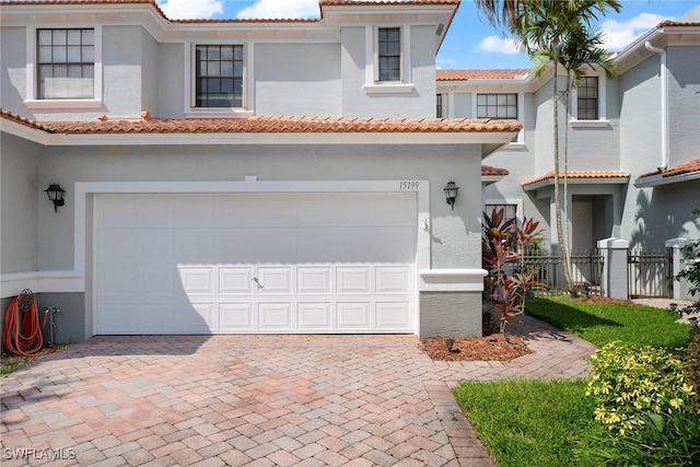 mediterranean / spanish house featuring a garage