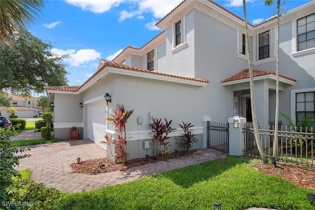 view of property exterior with a garage