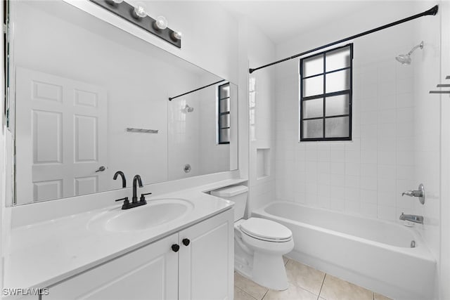 full bathroom with vanity, tiled shower / bath combo, toilet, and tile patterned flooring