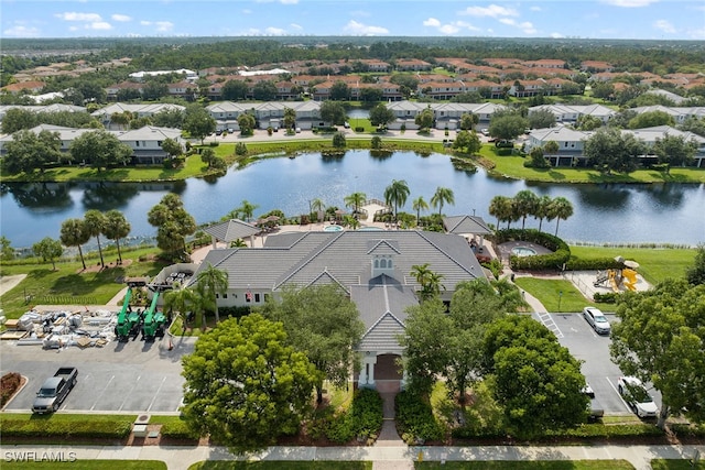 birds eye view of property with a water view