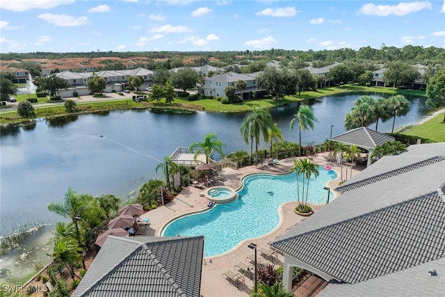 view of swimming pool with a water view, a patio area, and a gazebo