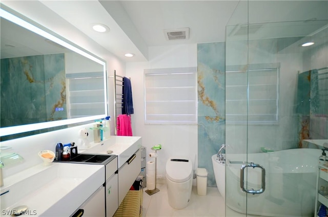 bathroom featuring walk in shower, vanity, tile patterned floors, and toilet