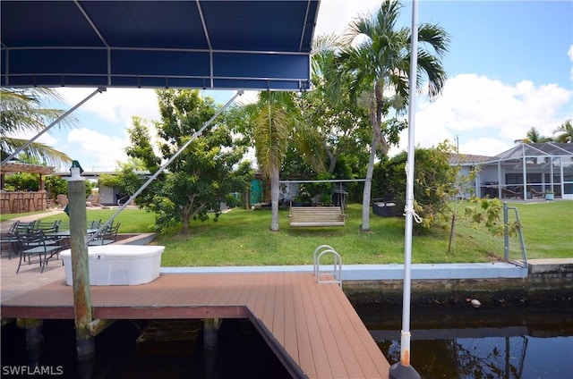 view of dock featuring a yard