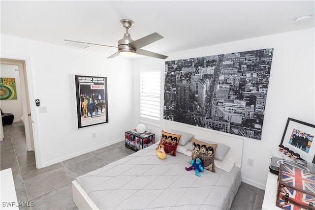 bedroom featuring ceiling fan and light tile patterned flooring