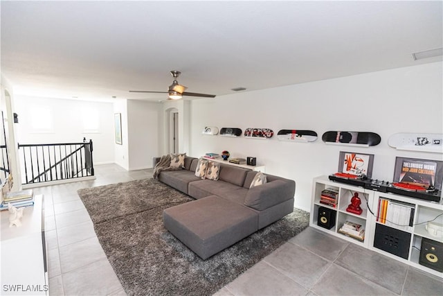 tiled living area featuring visible vents and ceiling fan