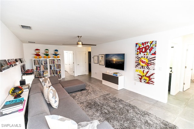 living area with ceiling fan and visible vents