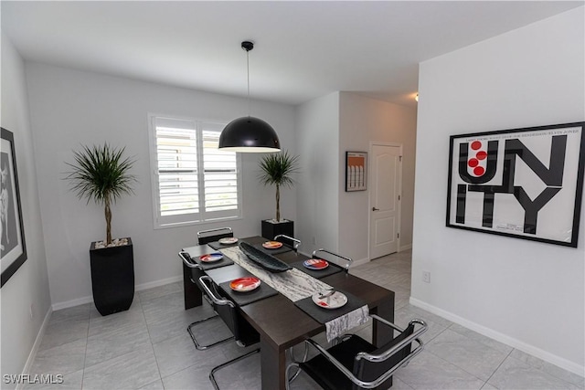 office space featuring baseboards and light tile patterned floors