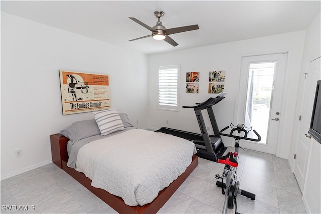 bedroom with a ceiling fan and baseboards