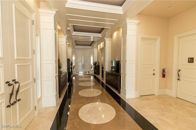 interior space with decorative columns, ornamental molding, and coffered ceiling