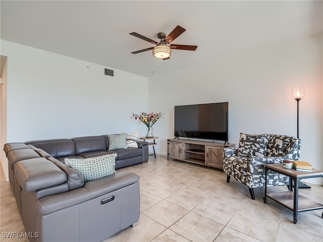 living room featuring light tile patterned floors and ceiling fan