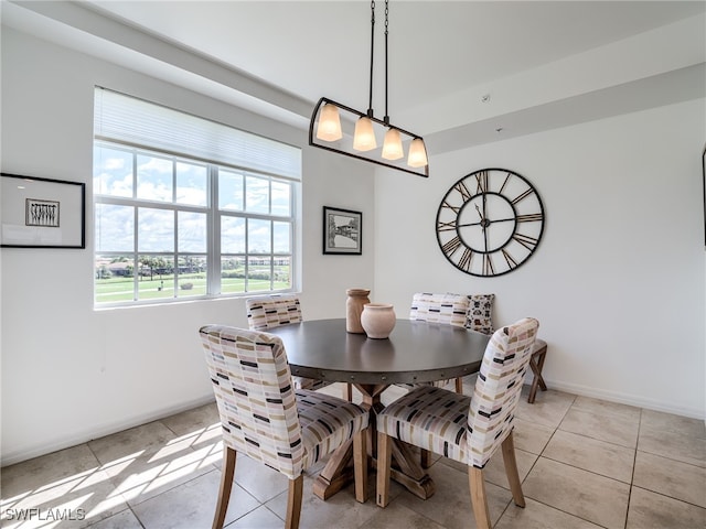 dining space with light tile patterned floors