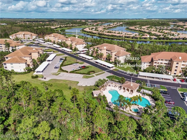 birds eye view of property with a water view