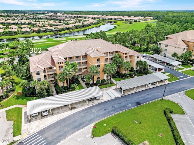 birds eye view of property with a water view